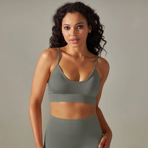 Detail of seamless ribbed texture and stretchy fabric on professional sports bra and yoga pants