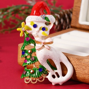Christmas brooch featuring white cat with Santa hat by green tree with rhinestones