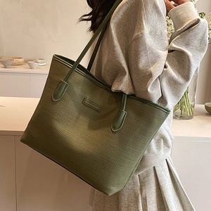 Olive green tote bag with mesh texture and top handles for women casual shoulder style