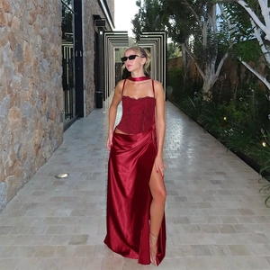 Dark red two-piece formal dress with lace corset bodice and high-slit satin skirt