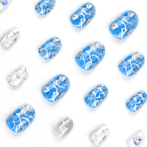 Short round blue moon and star press-on nails with silver glitter and rhinestones