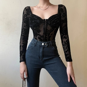 Detail of floral lace mesh bodysuit featuring off-shoulder long sleeves and sheer texture