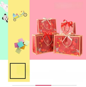 Close-up of red Chinese wedding gift bags with floral patterns and gold handles