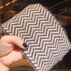 Black and white chevron knit headband with soft texture for winter outdoor warmth