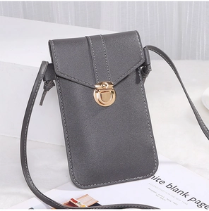 Detail of grey crossbody phone bag with gold twist lock and fine white stitching
