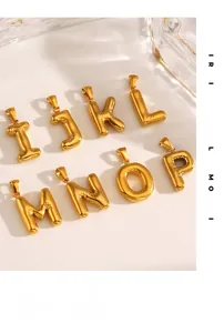 Macro shot of 3D puffy gold letter charms I to P with high-polish metallic finish