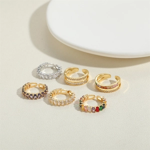 Macro shot of 14K gold plated zircon rings in assorted colors and adjustable open designs