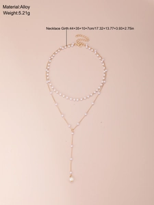 Double-layered Y-shaped necklace details with faux pearls and alloy chain specs