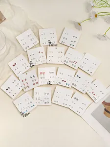 Flat lay of diverse stud earring sets including hearts, stars and animals on display cards