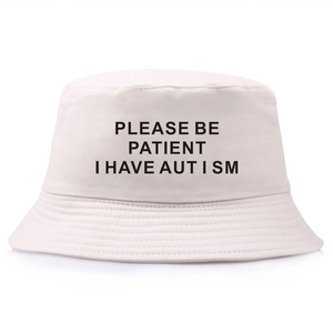 Beige bucket hat with Please Be Patient I Have Autism text print for autism awareness
