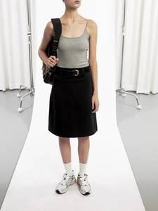 Slim fit black tank top for women paired with a high-waisted midi skirt and belt