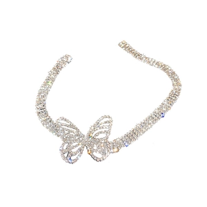 Glittering silver butterfly choker necklace with rhinestones in a minimalist studio shot