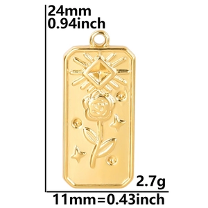 Detailed view of rectangular rose and sun embossed pendant with dimensions 24mm by 11mm