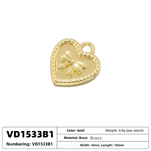 Detail of 9x10mm gold-plated brass heart pendant with embossed bow and measurement specs