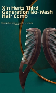 Macro detail of the brown translucent hair comb with ergonomic cutout handle design