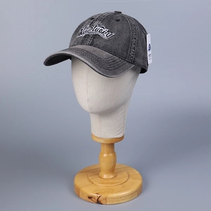 Close-up of washed gray denim baseball cap featuring white Kentucky letter embroidery