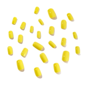 24 pieces of glossy lemon yellow medium long almond shaped press on nails on white background