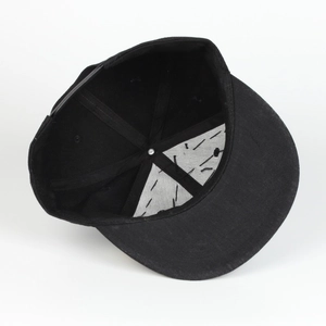 Detail of internal snapback cap structure with reinforced seams and adjustable strap