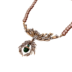Vintage necklace set with leaf pendant, rose gold pearls, and green teardrop gemstone