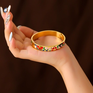 Elegant 18K gold plated stainless steel bangle with colorful floral enamel pattern