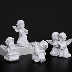 Set of four white resin cherub angel figurines in praying and sleeping poses