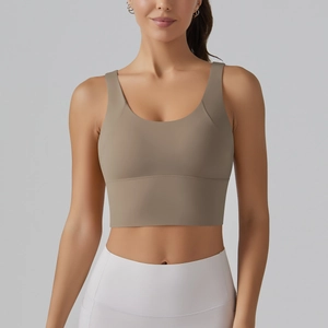 Close-up of wide supportive underband and seamless taupe fabric on V-back sports bra