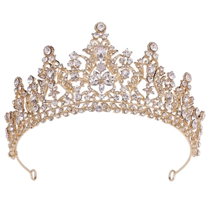 Detailed view of luxury gold bridal tiara with sparkling crystal flower patterns