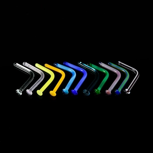 Macro shot of colorful glass L-shaped nose studs in ten vibrant glossy finishes