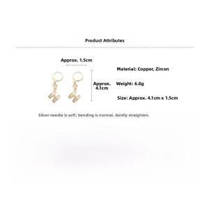 Detailed view of gold plated H-shaped earrings with rectangular zircons and pearl studs