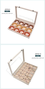 Detail view of 12 and 18-compartment jewelry boxes with clear glass lids and metal latches