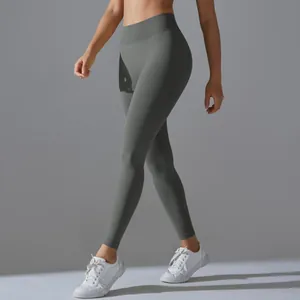Detailed texture of seamless high-waisted yoga leggings in dark olive green finish
