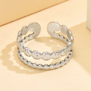Silver double-layer open ring featuring smiley face patterns and beaded texture detail