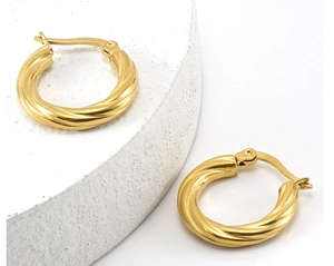 Detailed view of 18K gold-plated stainless steel hoop earrings with textured twist design