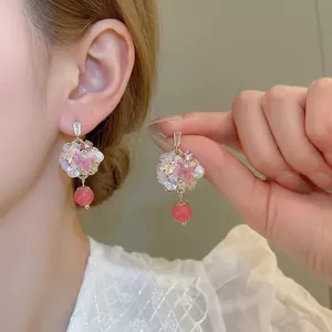 Elegant floral pearl drop earrings with pink crystal and gold metal finish for women