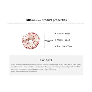 Detail of floral strawberry scrunchie showing 18cm diameter and 22.1g cloth material
