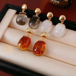 Waterdrop resin earrings set in amber, smoky grey and milky white with 18K gold plating