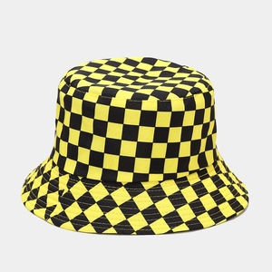 Detail of yellow and black checkered bucket hat with reinforced stitching on the brim