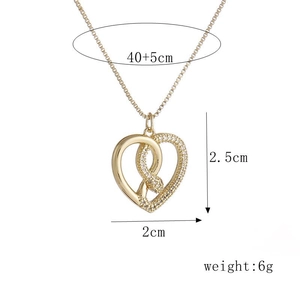 18k gold snake heart necklace with zircons measuring 40+5cm length and 2.5cm pendant height