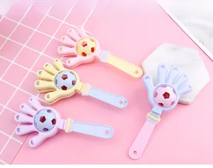 Detailed view of macaron-colored hand clapper toys with creative soccer ball center design