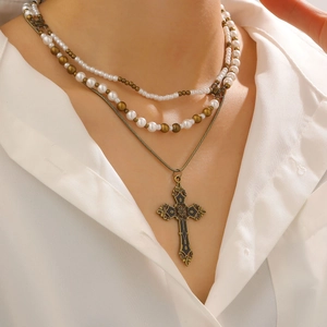 Vintage layered pearl cross necklace in antique gold finish for a retro gothic look