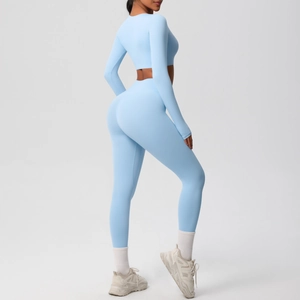 Side view of light blue yoga set with long sleeve crop top and high waist leggings