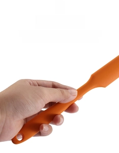 Ergonomic orange silicone spatula handle with hanging hole for kitchen organization