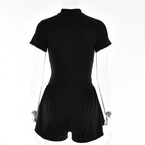 Macro detail of black short sleeve romper bodysuit with mock neck and cinched waist