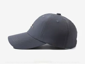 Detailed side view of a dark grey baseball cap with classic embroidery and reinforced brim