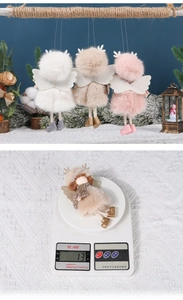 Detail view of plush Christmas angel pendants with wings and antlers weighing 13g each