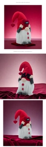 Close-up of three lighted Valentine gnomes with red heart caps and LOVE signs