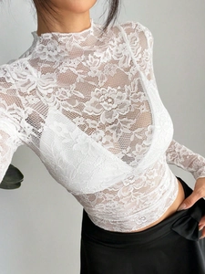Slim fit white lace long sleeve turtleneck top with intricate floral crochet detail