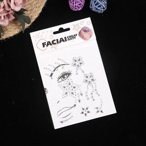 Detailed view of silver holographic star and teardrop facial gemstone stickers in packaging