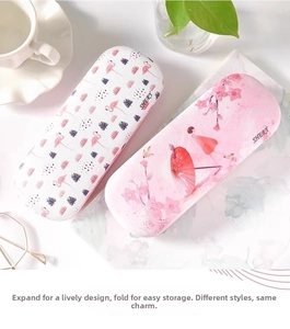 Detail of hard-shell glasses cases with flamingo and watercolor lady prints for protection