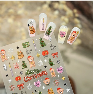 Macro detail of Christmas bear nail stickers featuring festive trees and snowflakes